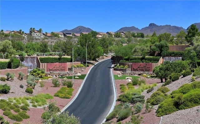 view of road featuring a mountain view and street lighting