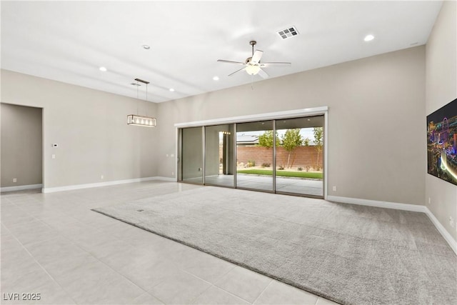 interior space featuring recessed lighting, visible vents, baseboards, and ceiling fan