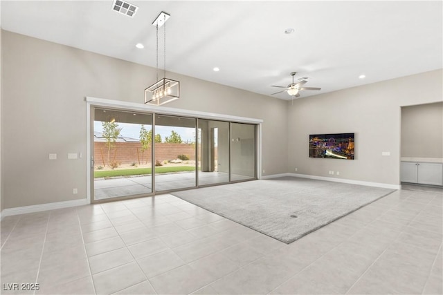 unfurnished living room featuring recessed lighting, visible vents, ceiling fan with notable chandelier, and baseboards