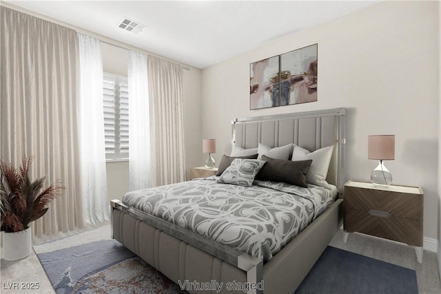 carpeted bedroom featuring visible vents