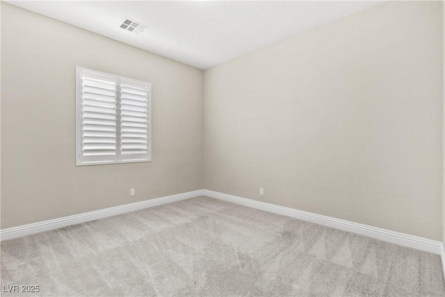 unfurnished room featuring carpet flooring, baseboards, and visible vents