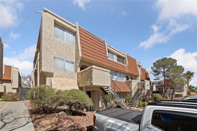 view of building exterior featuring stairway