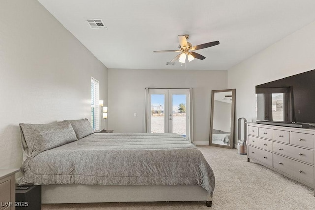 bedroom featuring visible vents, ceiling fan, light carpet, french doors, and access to outside