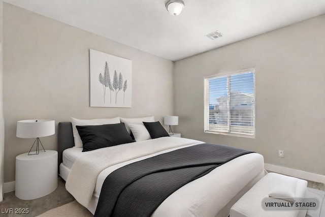 bedroom featuring visible vents and baseboards