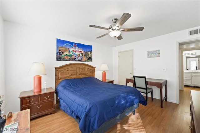 bedroom with light wood-style flooring, baseboards, visible vents, and ceiling fan