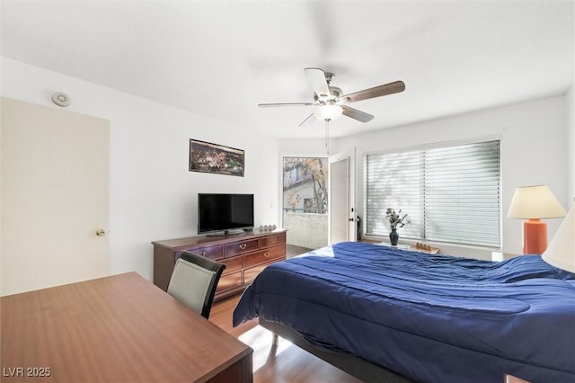 bedroom featuring a ceiling fan and wood finished floors