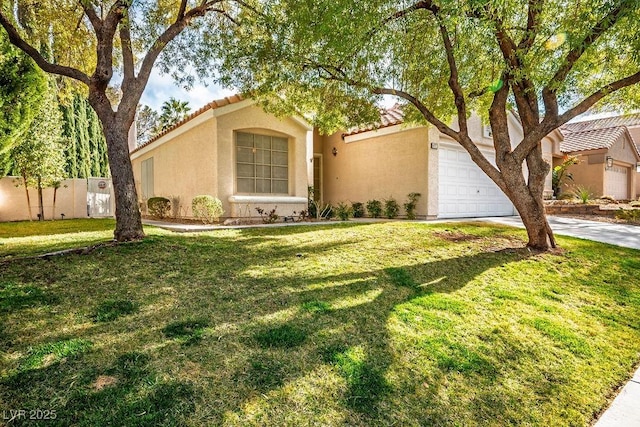 view of front facade with driveway, stucco siding, a front lawn, a garage, and a tiled roof