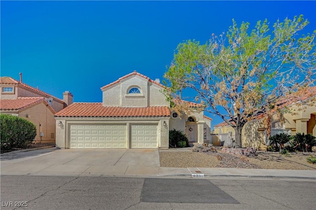 mediterranean / spanish-style home featuring stucco siding, a tiled roof, concrete driveway, and an attached garage