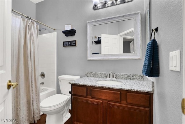 full bathroom featuring toilet, vanity, and shower / tub combo