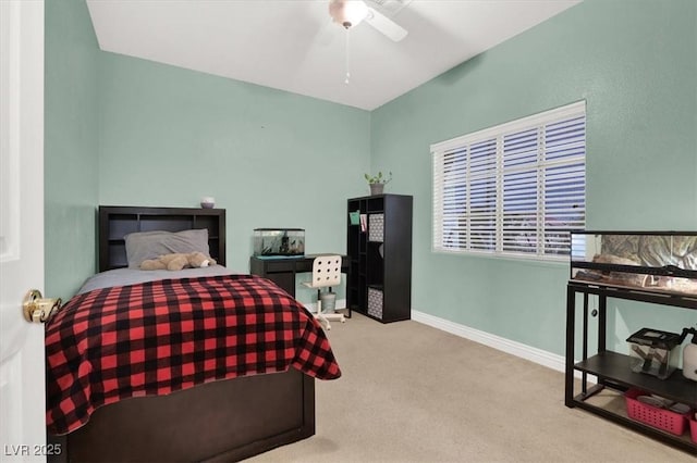 carpeted bedroom with baseboards and a ceiling fan