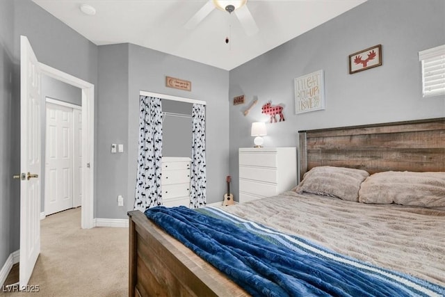 bedroom with ceiling fan, baseboards, and light carpet