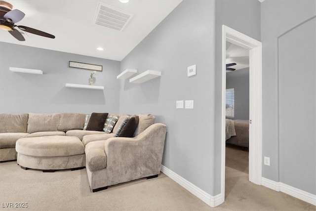 carpeted living room featuring recessed lighting, visible vents, baseboards, and a ceiling fan