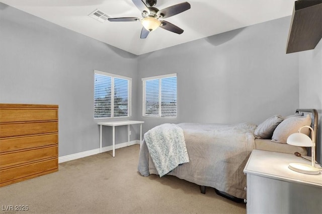 bedroom with light carpet, visible vents, ceiling fan, and baseboards