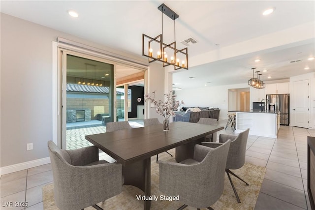 dining space with visible vents, recessed lighting, light tile patterned flooring, a fireplace, and baseboards