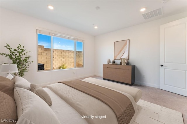 bedroom with recessed lighting, visible vents, baseboards, and light colored carpet