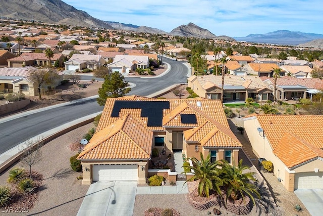 birds eye view of property with a mountain view and a residential view