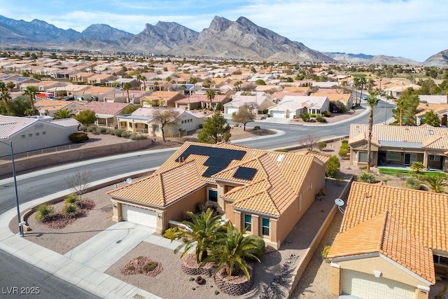 drone / aerial view featuring a mountain view and a residential view