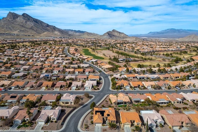 birds eye view of property with a mountain view and a residential view