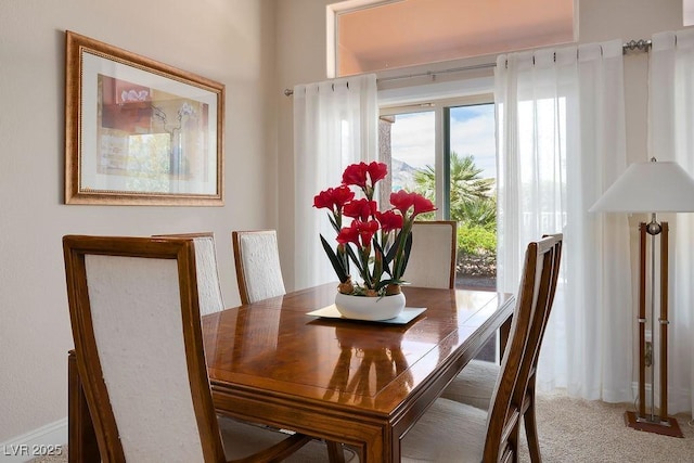 view of carpeted dining space