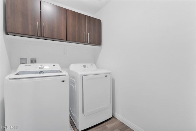 12367 Indigo Montage Rd Unit 3, Las Vegas, NV 89183 - laundry room featuring cabinet space, separate washer and dryer, light wood-style flooring, and baseboards