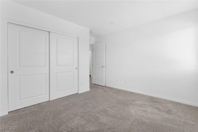 12367 Indigo Montage Rd Unit 3, Las Vegas, NV 89183 - unfurnished bedroom featuring carpet floors, a closet, and baseboards