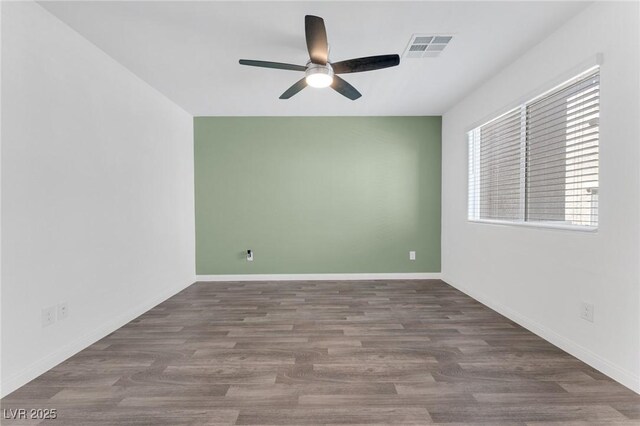 12367 Indigo Montage Rd Unit 3, Las Vegas, NV 89183 - empty room featuring a ceiling fan, wood finished floors, and baseboards