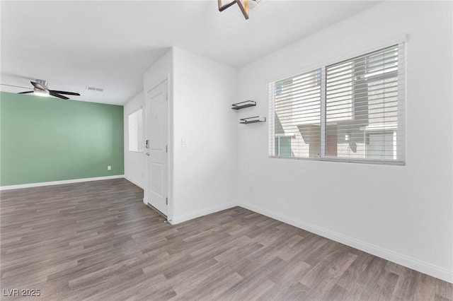 12367 Indigo Montage Rd Unit 3, Las Vegas, NV 89183 - unfurnished room featuring ceiling fan, wood finished floors, and baseboards