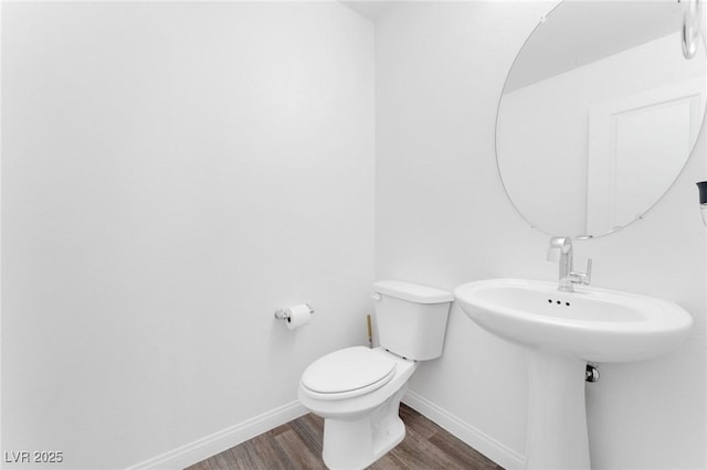 12367 Indigo Montage Rd Unit 3, Las Vegas, NV 89183 - half bath featuring baseboards, wood finished floors, and toilet