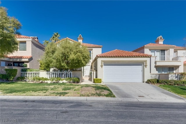 mediterranean / spanish-style home with stucco siding, an attached garage, driveway, and fence