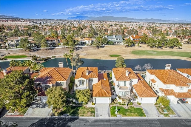 aerial view featuring a residential view and a water and mountain view