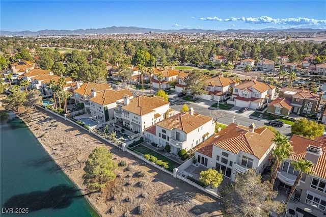 birds eye view of property with a residential view and a water and mountain view