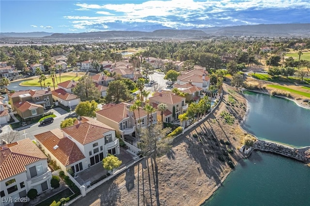 birds eye view of property featuring a residential view and a water and mountain view