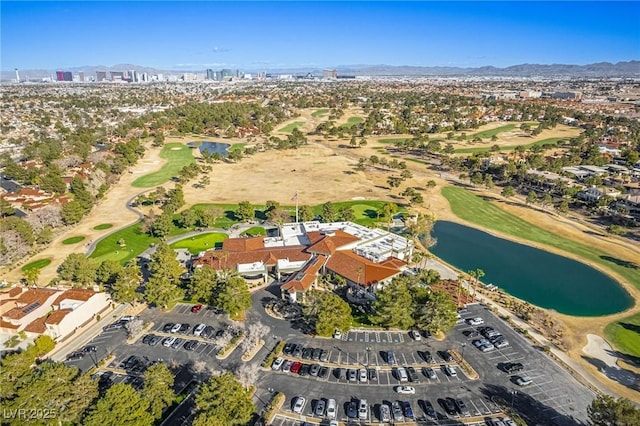 aerial view featuring a water view and view of golf course