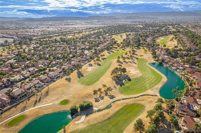 aerial view with golf course view, a residential view, and a water and mountain view