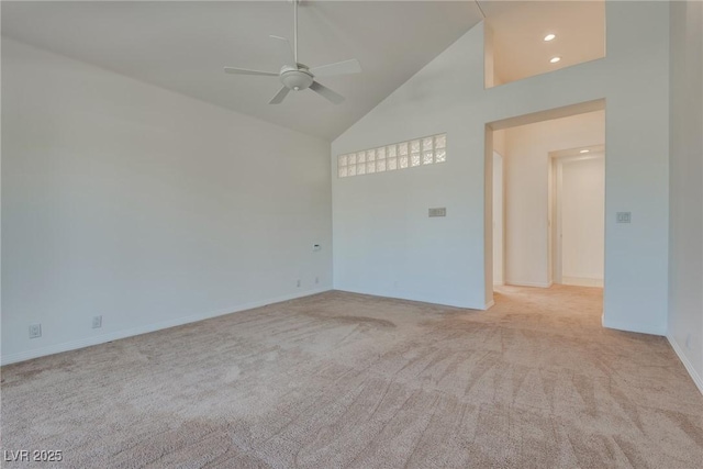 empty room featuring recessed lighting, carpet floors, high vaulted ceiling, and a ceiling fan