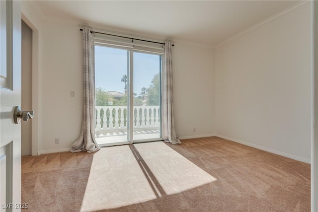 spare room with baseboards, light carpet, and ornamental molding