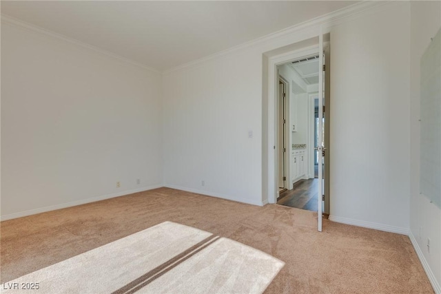 unfurnished room featuring light carpet, visible vents, baseboards, and ornamental molding