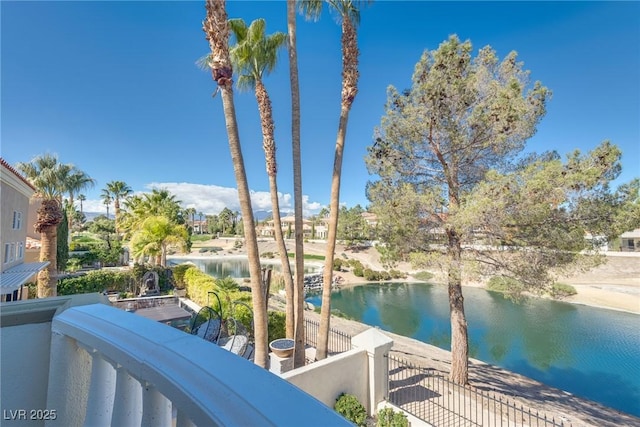 balcony featuring a water view