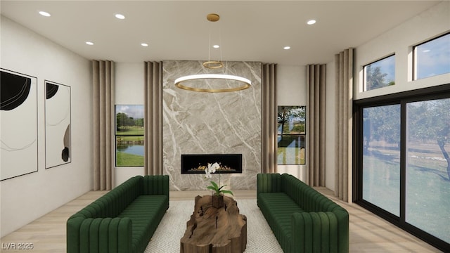 living room with recessed lighting and a premium fireplace