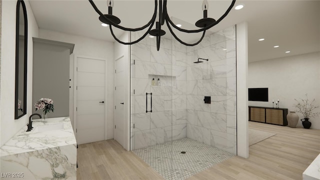 full bath with recessed lighting, wood finished floors, a stall shower, and vanity