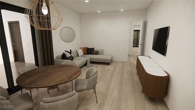 living area featuring recessed lighting and light wood finished floors