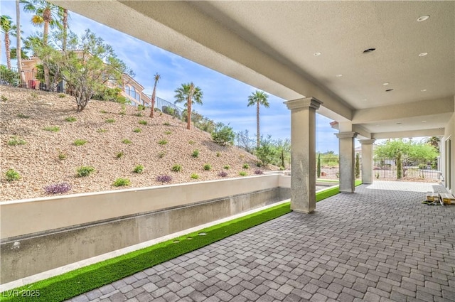 view of patio / terrace featuring fence