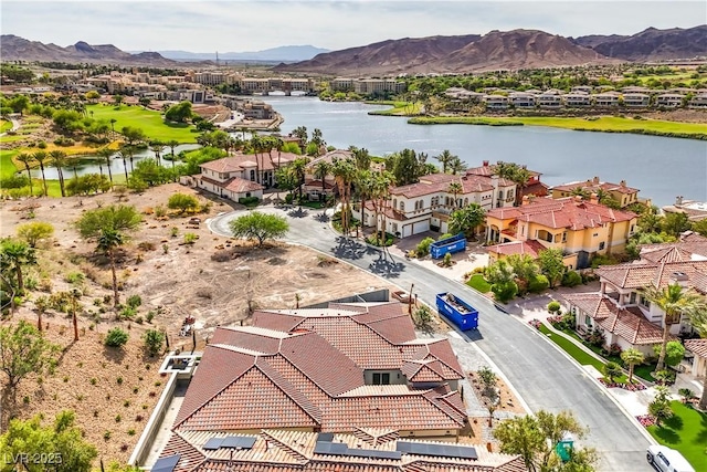 bird's eye view featuring a residential view and a water and mountain view