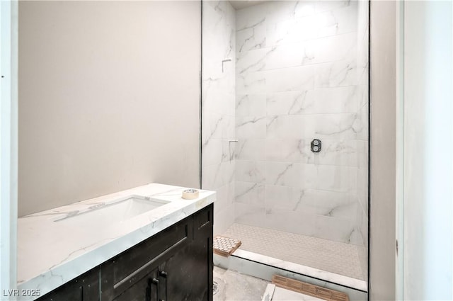 bathroom with a stall shower and vanity
