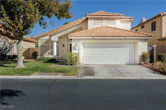 mediterranean / spanish house with a front lawn, fence, a tiled roof, a garage, and driveway