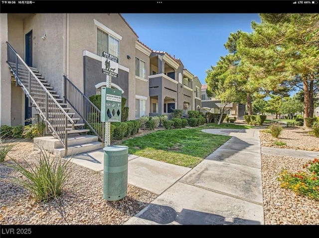 view of property's community with stairs and a residential view