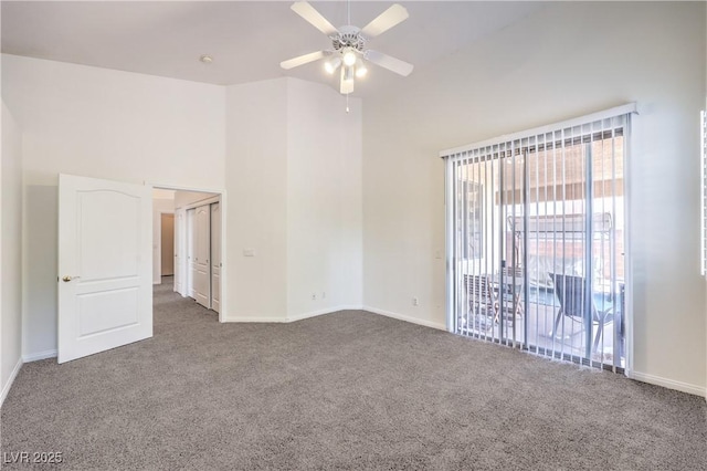 1970 Jasper Creek Pl, Las Vegas, NV 89123 - carpeted empty room with ceiling fan, a towering ceiling, and baseboards