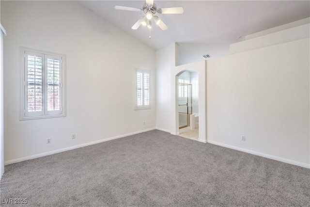 1970 Jasper Creek Pl, Las Vegas, NV 89123 - carpeted empty room with arched walkways, a ceiling fan, plenty of natural light, baseboards, and high vaulted ceiling