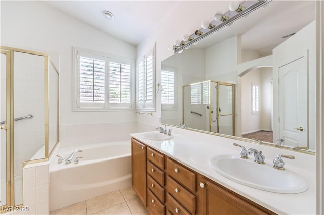 1970 Jasper Creek Pl, Las Vegas, NV 89123 - full bathroom with a stall shower, a bath, double vanity, tile patterned floors, and vaulted ceiling