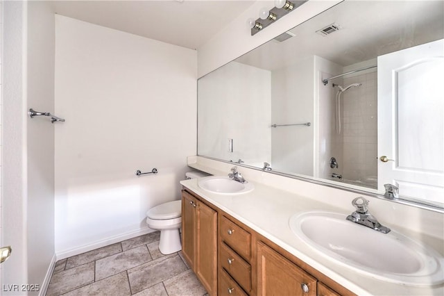 1970 Jasper Creek Pl, Las Vegas, NV 89123 - bathroom featuring double vanity, toilet, baseboards, and shower / bath combination
